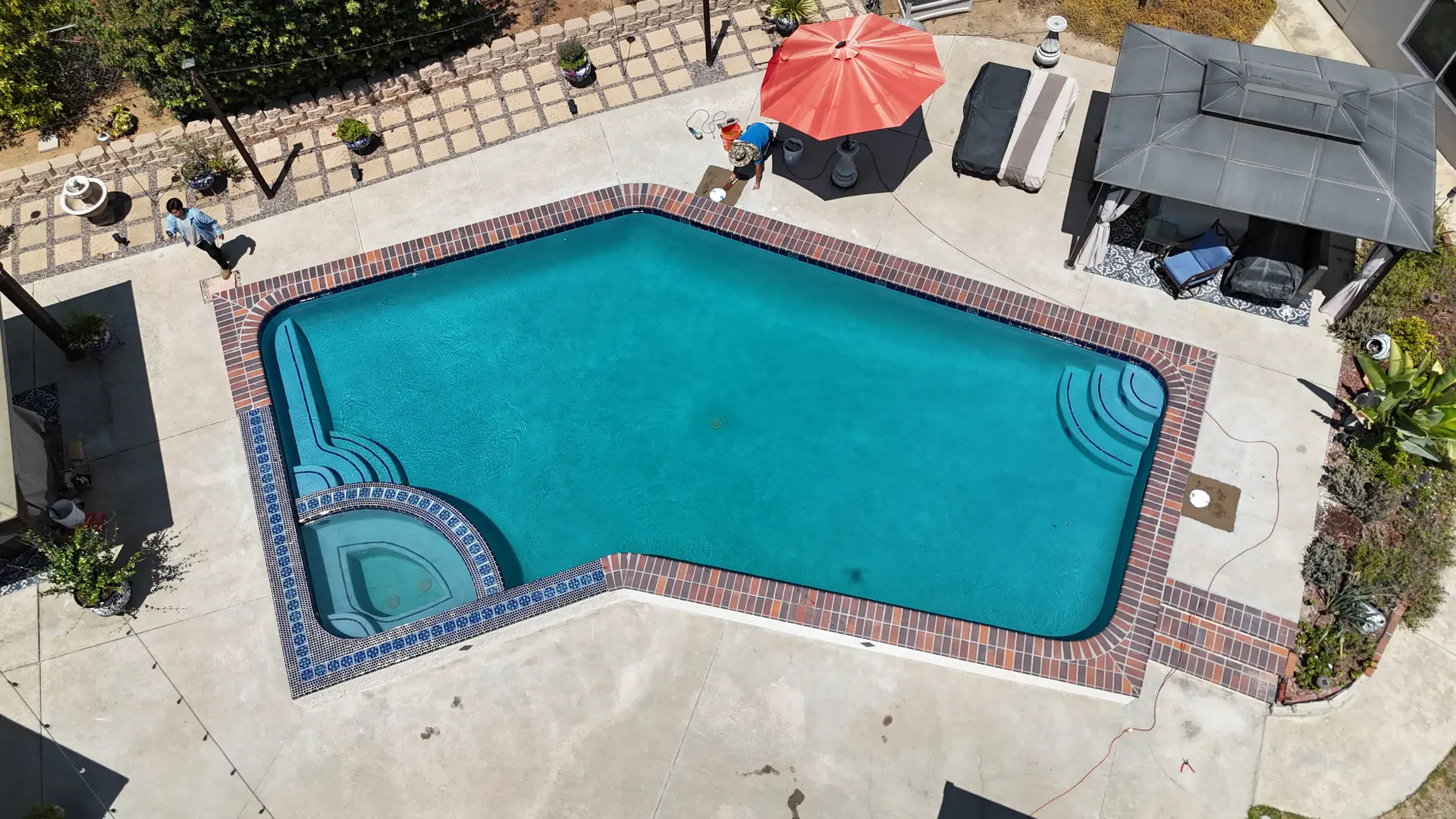 Aerial view of a finished rectangular pool and raised spa remodel in Escondido, CA